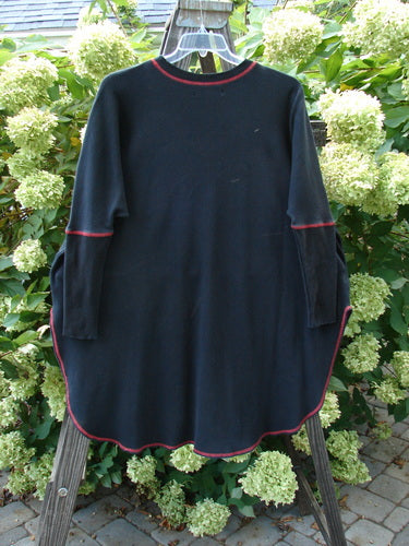 Barclay Thermal Contrast Revival Top Continuous Cityscape Black OSFA on a hanger, featuring ribbed sleeves, a rounded neckline, and a unique cityscape paint design.