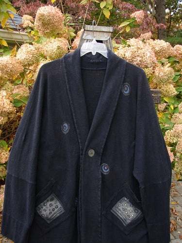1995 Reprocessed Deco Jacket Polka Gal Black OSFA, featuring blue patches, double buttonhole closure, drop dolman shoulders, long arms, oversized diagonal pockets, and a deep V neckline with rear stand-up collar.