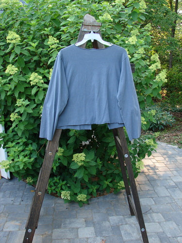 Barclay Cotton Lycra Long Sleeved Shrug Trail Vine Stormy Size 1 displayed on a hanger, featuring longer regular width sleeves, an open front, varying hemline, and trailing garden vine theme paint.