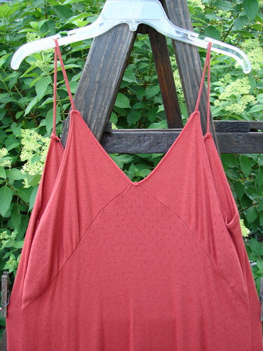 2000 Wool Pointelle Lulu Slip Dress Sienna Unpainted Tiny Size 2 displayed on an outdoor swing, highlighting thin shoulder straps, criss-cross upper bodice, and horizontal lower lettuce edging.