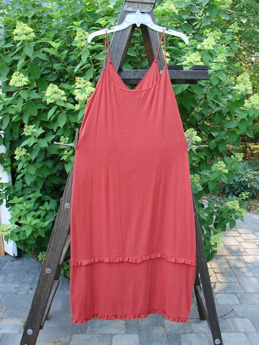 2000 Wool Pointelle Lulu Slip Dress Sienna Unpainted Tiny Size 2: A red dress on a clothes rack, featuring sweet eyelets, thin shoulder straps, and a widening flair with lettuce edging.