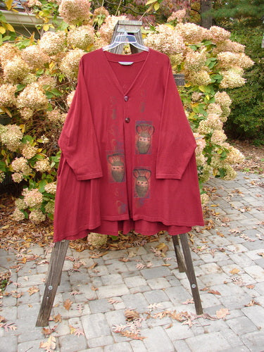 1997 Mask Jacket Primitive Vase Regalia Size 2 on a rack, showcasing a bell shape, two special button closures, deep side pockets, and a varying swing hemline, made from mid-weight cotton.