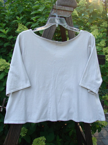 Barclay Crop Tee Top with Bountiful Cacti theme, featuring a rounded neckline, generous short sleeves, and altered hem to crop length, displayed on a swinger.