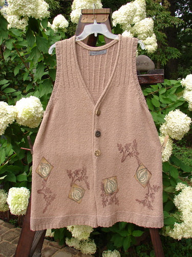1998 Teton Sweater Vest with flowers, ceramic buttons, and a V neckline. A-line shape, ribbed hemline, and Blue Fish patch.