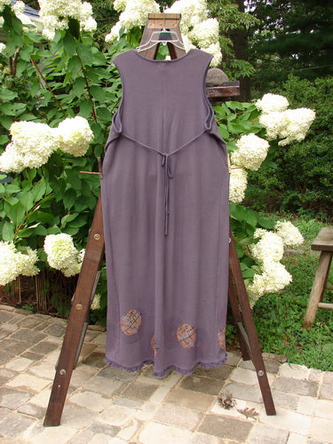 2000 Thermal Lannean Jumper Ric Rack Brum Size 0 displayed on a wooden ladder, showcasing its longer bell shape, rounded V neckline, and flannel front pockets with piping details.