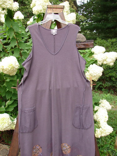 2000 Thermal Lannean Jumper Ric Rack Brum Size 0 displayed on an outdoor swing, showcasing its flannel front pockets, rounded V neckline, bell shape, and side laced hemline.