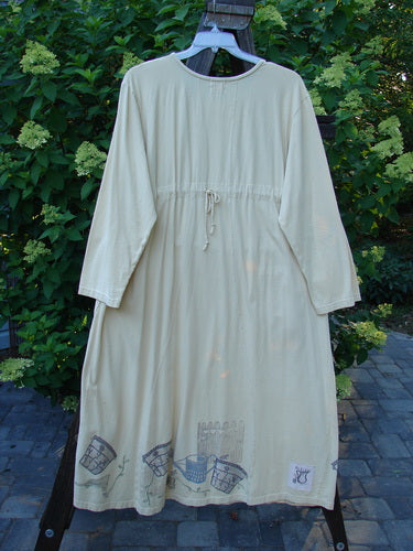 1999 Tea Time Dress Fancy Pot Buttercup Size 2 displayed on a swing, showcasing its hourglass shape, elastic-topped pockets, and detailed flower pot theme paint.