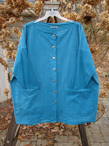 Barclay Cotton Sleeve Hemp Jacket Unpainted Aqua Size 2 displayed on a hanger; features metal buttons, boatneck, oversized pockets, and vertical panels; showcasing medium wear and fade.