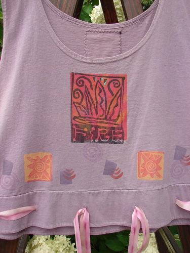 1992 Camisette Top Fire Lavender OSFA featuring pink ribbons, a scooped neckline, swingy hemline with button holes, and a signature Blue Fish patch on the back.