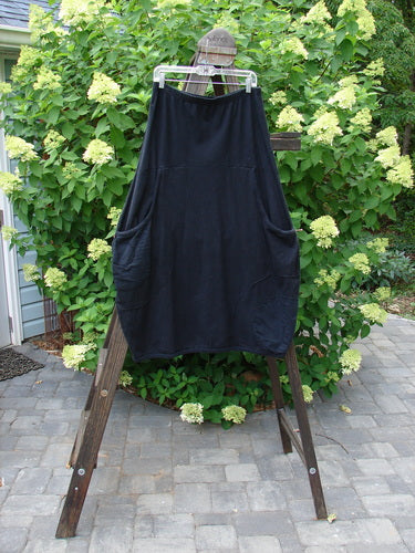 Barclay Cotton Hemp Panel Pocket Circle Skirt Unpainted Black Size 2 on a rack, showcasing deep front pockets, full elastic waistline, and Celtic Moss accents.
