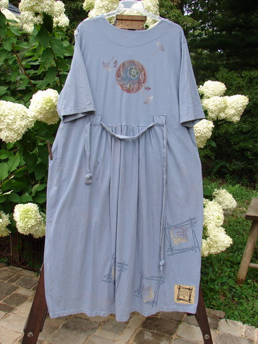 1999 Sukura Dress Asian Fan Bluestone Size 2, featuring three-button front, optional accent belt, two large front pockets, and a gathered rear skirt, highlighting the unique 1999 Fall Theme paint design.