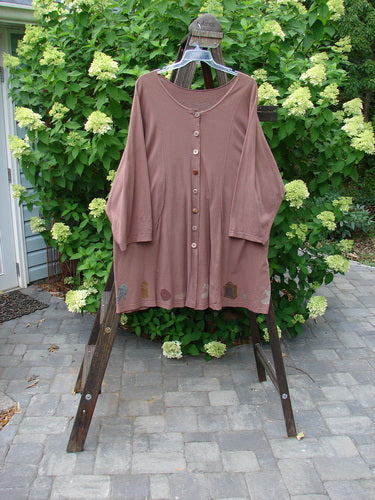 1993 Blueline Jacket Antique Aircraft Dried Rose Size 2 displayed on a rack, showcasing detailed colorful vintage travel theme paint and unique vertically curved panels with drawcord ties.