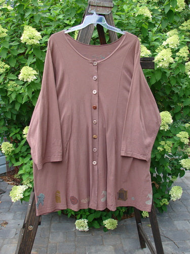 1993 Blueline Jacket Antique Aircraft Dried Rose Size 2, displayed on a rack, featuring vibrant vintage aircraft-themed paint and unique panel design with drawcord ties.