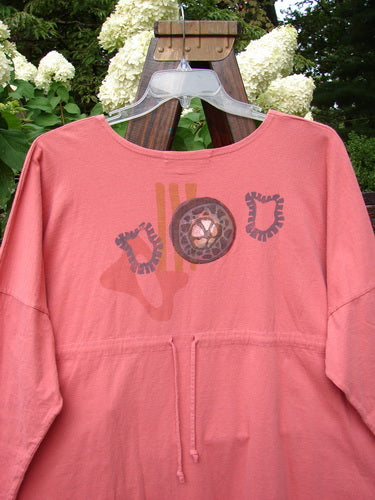 1996 Long Sleeved Pop Top Boulder City Oriole OSFA featuring a rounded hemline, scooped rolled neckline, drop shoulders, oversized front pocket with ceramic button, and a rear drawcord back.