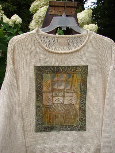 1999 Limited Edition Patched Boxy Pullover Sweater Window Chair Tea Dye OSFA featuring a giant patched front with a thinking chair and window theme. Boxy shape with ribbed hem and softly rolled neckline.