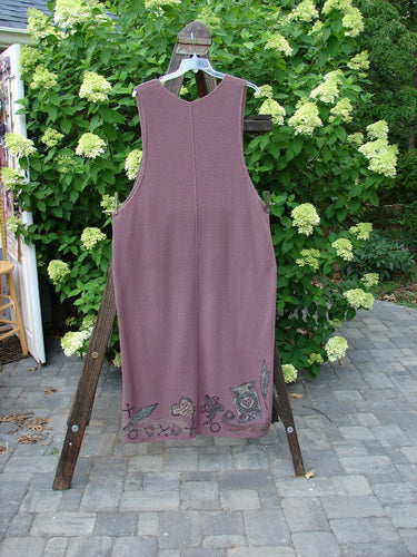 1993 Waffle Pocket Jumper Sweater Heart Feather Dusty Plum Size 2 on a clothes rack, showcasing its painted front pocket and V neckline.