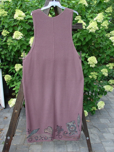 1993 Waffle Pocket Sweater Jumper Heart Feather Dusty Plum Size 2 on a rack, featuring a plunging V neckline, vintage heart feather design, oversized front painted pocket, and deep arm openings.