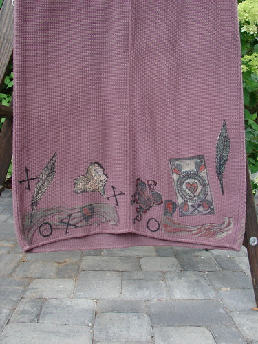 1993 Waffle Pocket Sweater Jumper Heart Feather Dusty Plum Size 2, featuring a painted front pocket with a playing card and feather design, displayed on a stone walkway.