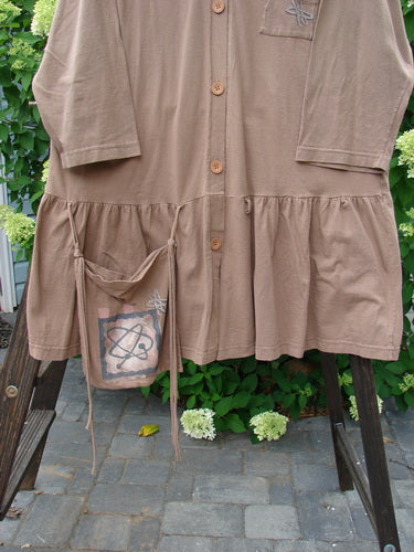 1995 Clothespin Jacket Space Travel Mudpie OSFA displayed on a hanger, showcasing a unique flared lower flounce, single large pocket, and distinctive Blue Fish buttons.