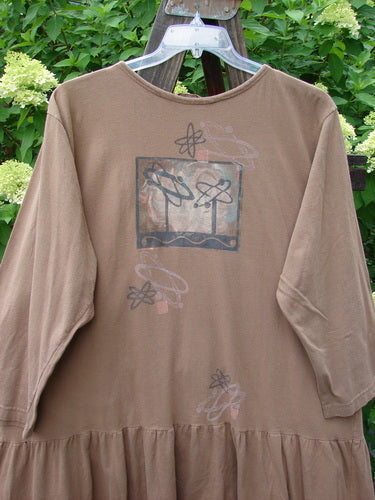 1995 Clothespin Jacket Space Travel Mudpie OSFA: A brown shirt with a picture on it featuring a fun kicking flared lower flounce and a sweet bottom flounce adorned by the signature Blue Fish patch.