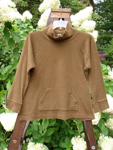 2000 Wool Funnel Neck Raglan Top Unpainted Pebble Smaller Size 1. A brown sweater on a swinger with a cargo pocket.