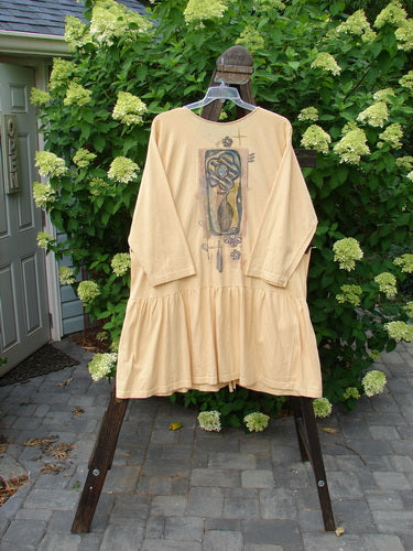 1995 Clothespin Jacket Celebrate Glint OSFA displayed on a swinger, featuring long sleeves, a flared lower flounce, and two painted tie-on pockets with original Blue Fish buttons.
