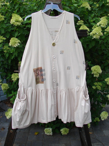 1995 Voyager Vest Festive Swan China Size 2, featuring elastic side drop pockets, deep V neckline, original buttons, and a gathered bottom flounce, displayed on a hanger.