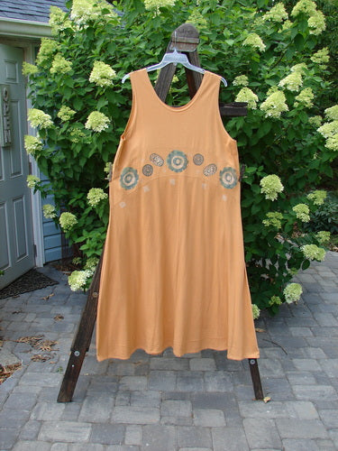 1995 Zelda Jumper Dress Abstract Peachy Keen Size 2 displayed on a clothes rack with a sweeping A-line shape, downward yoked waist seam, and rounded scooped neckline, showcasing handstitched hemline.