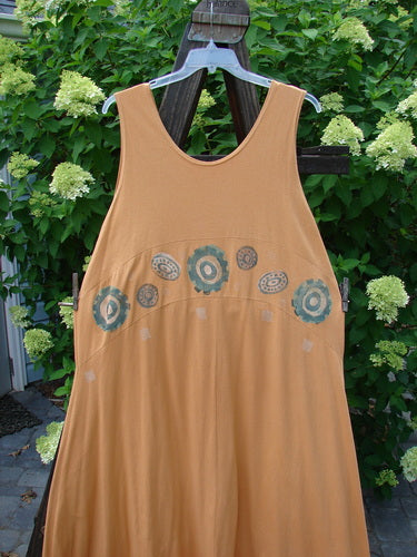 1995 Zelda Jumper Dress Abstract Peachy Keen Size 2 displayed on a dress form, showcasing a sweeping A-line shape, deep scooped neckline, and hand-stitched hem with an abstract pattern.