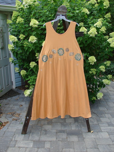 1995 Zelda Jumper Dress Abstract Peachy Keen Size 2 displayed on a clothing rack, showcasing its sweeping A-line shape and handstitched hemline with an abstract pattern.