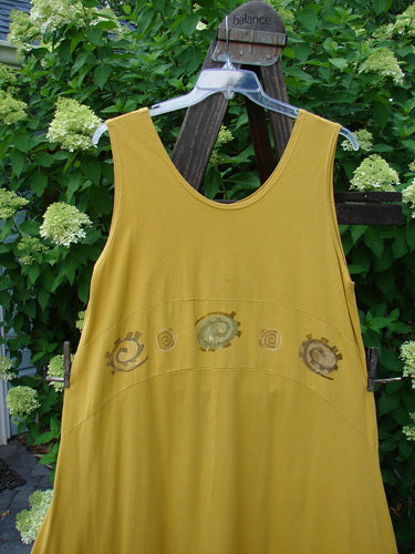 1995 Zelda Jumper Dress Abstract Key Lemon Size 2 on a swing, featuring a rounded neckline, A-line shape, and continuous abstract pattern from the Resort Collection.