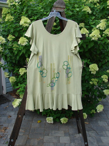1996 Butterfly Dress Pebble Path Seedling Size 2 displayed on a rack, featuring shorter ruffled sleeves, lower ruffled hem, deep rounded neckline, and slight A-line flair in perfect condition.