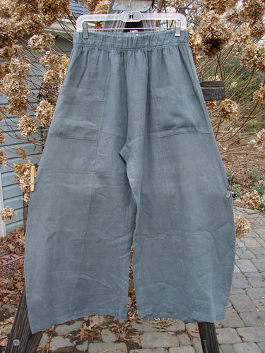 Barclay Linen Crop Side Pocket Pant Unpainted Dusty Sky Size 0: A billowing pair of linen pants with vertical sectional panels and upper hip front pockets.