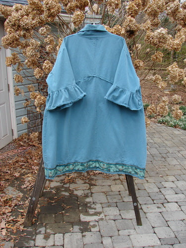 Barclay Decora Brushed Twill Flutter Coat Vine Flower Peacock Size 2: A stylish coat with a deep V neckline, flutter sleeves, and a swingy hemline. Features a wrap-around waistline and matching buttons.