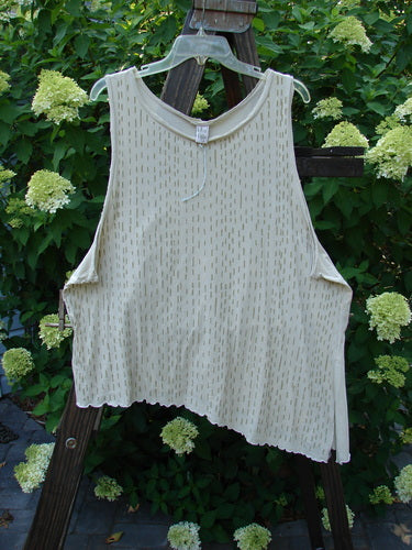 Barclay Batiste Curly Seam Tank Rain Sand Size 2 displayed on a hanger outdoors, highlighting curly edgings, asymmetrical hem, and rain-themed paint.