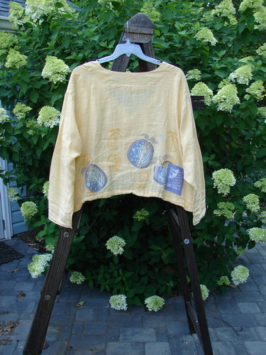 1999 Weathervane Jacket Summer Fruit Buttercup Size 2 displayed on a swing, featuring unique front mix-match buttons, a deeper V-shaped neckline, and a summer fruit theme paint.