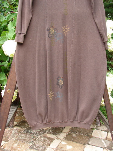 1996 Thermal Day Dress Celestial Molasses Size 2 displayed on a wooden ladder, showcasing its long sleeves, mock rib T-neck, ribbed cuffs and hemline, with celestial-themed paint detailing.