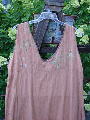 1997 Gauze Rosette Slip Dress, Drift Daisy Rose Shadow, Size 2. A pink dress on a swinger with shortened shoulder straps. Made from double-layered cotton gauze with silk rainbow ribbon edging. Varying gathered and draped hemline. Light as air, sways with the slightest breeze.