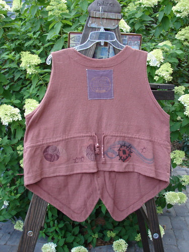1995 Reprocessed Drawing Room Vest Windy Planet Clove OSFA shown on a hanger, featuring three ceramic buttons, tailored drawcord back, shirt tail hemline, and a front pocket, made from thick reprocessed cotton.