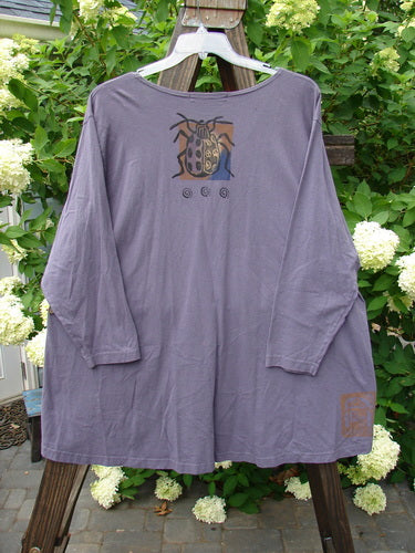 1996 Triangle Cardigan Garden Bug Purple Martin OSFA: Long-sleeved, deep V-neck cardigan with a bug design, angled front pockets, varying hemline, and original buttons. Made from mid-weight organic cotton.