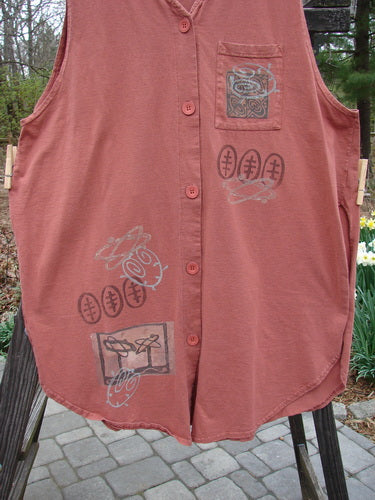 1995 Breeze Vest Space Odyssey Russet OSFA: A red vest with drawings, a rounded front and back shirttail hemline, a deep V-shaped neckline, tall rounded vented sides, a front painted breast pocket, a sweet tabbed upper rear, super back drop gathers, and original Blue Fish recycled paper buttons.