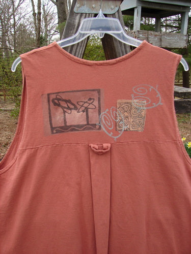 A close-up of a 1995 Breeze Vest in Russet, featuring a deep V-shaped neckline, rounded front and back shirttail hemline, and tall rounded vented sides. The vest has a front painted breast pocket, a sweet tabbed upper rear, and super back drop gathers. Made from organic cotton, it includes all original Blue Fish recycled paper buttons and a Space Odyssey theme paint.