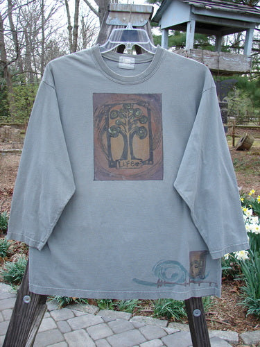 2000 Long Sleeved Tee Tree of Life Park Size 1, featuring a colorful tree drawing, rolled and ribbed neckline, drop shoulders, and a straight, generous shape, made of mid-weight organic cotton.