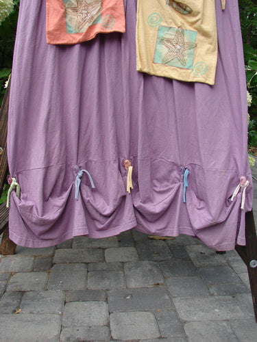 1997 Salt Water Taffy Jumper Summer Ocean Jasmine Size 2, featuring tie-on tie-off pockets, clear textured buttons, and versatile rippie accents, displayed against a stone floor backdrop.