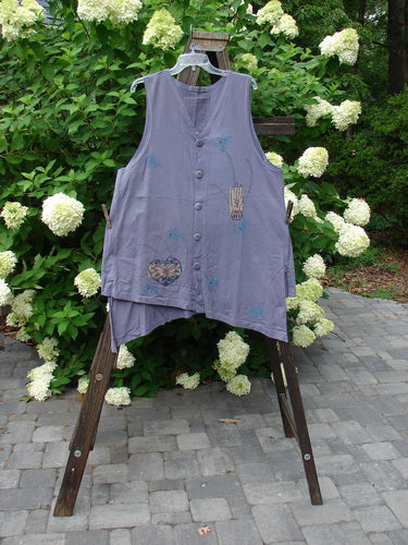 1996 Seeker's Vest Heart Mulberry OSFA displayed on a clothes rack, featuring an A-line shape, deep V neckline, unique hemline accents, and Blue Fish buttons.