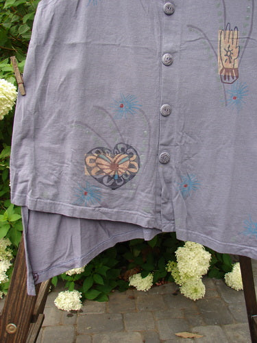 Close-up of the 1996 Seeker's Vest Heart Mulberry OSFA, showcasing its A-line shape, deep V neckline, abstract heart theme paint, and original Blue Fish buttons.