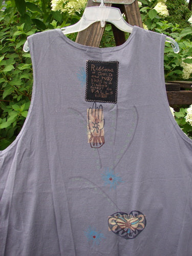 1996 Seeker's Vest Heart Mulberry OSFA: Grey vest with abstract heart design, deep V neckline, and varying hemline, displayed on a hanger. Features Blue Fish buttons and patch, perfect condition.