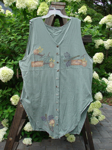 1994 Cricket Vest Dragonfly Garden Seaweed Size 2: A green shirt with a dragonfly design on it, perfect condition, made from medium weight cotton. Features include a fabulous round front hemline, squared off rear hemline, and tons of original smaller buttons. A super fun vest with a great drape!