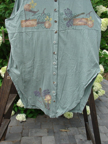 1994 Cricket Vest Dragonfly Garden Seaweed Size 2 displayed on a rack, showcasing a round front hemline, squared rear hemline, and intricate dragonfly design with multiple buttons.