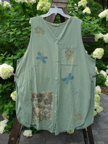 1995 Breeze Vest with dragonflies and flowers, made from organic cotton. Rounded front and back shirttail hemline, deep V-shaped neckline, and tall rounded vented sides. Features a front painted breast pocket, tabbed upper rear, and super back drop gathers.